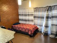 Bed Room 1 of property in Braamfontein