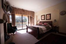 Main Bedroom - 26 square meters of property in Woodhill Golf Estate