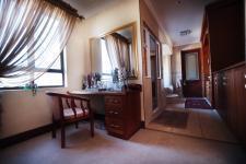 Main Bedroom - 26 square meters of property in Woodhill Golf Estate