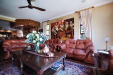 Informal Lounge of property in Woodhill Golf Estate