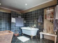 Main Bathroom of property in Woodhill Golf Estate