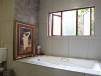 Main Bathroom of property in Woodhill Golf Estate