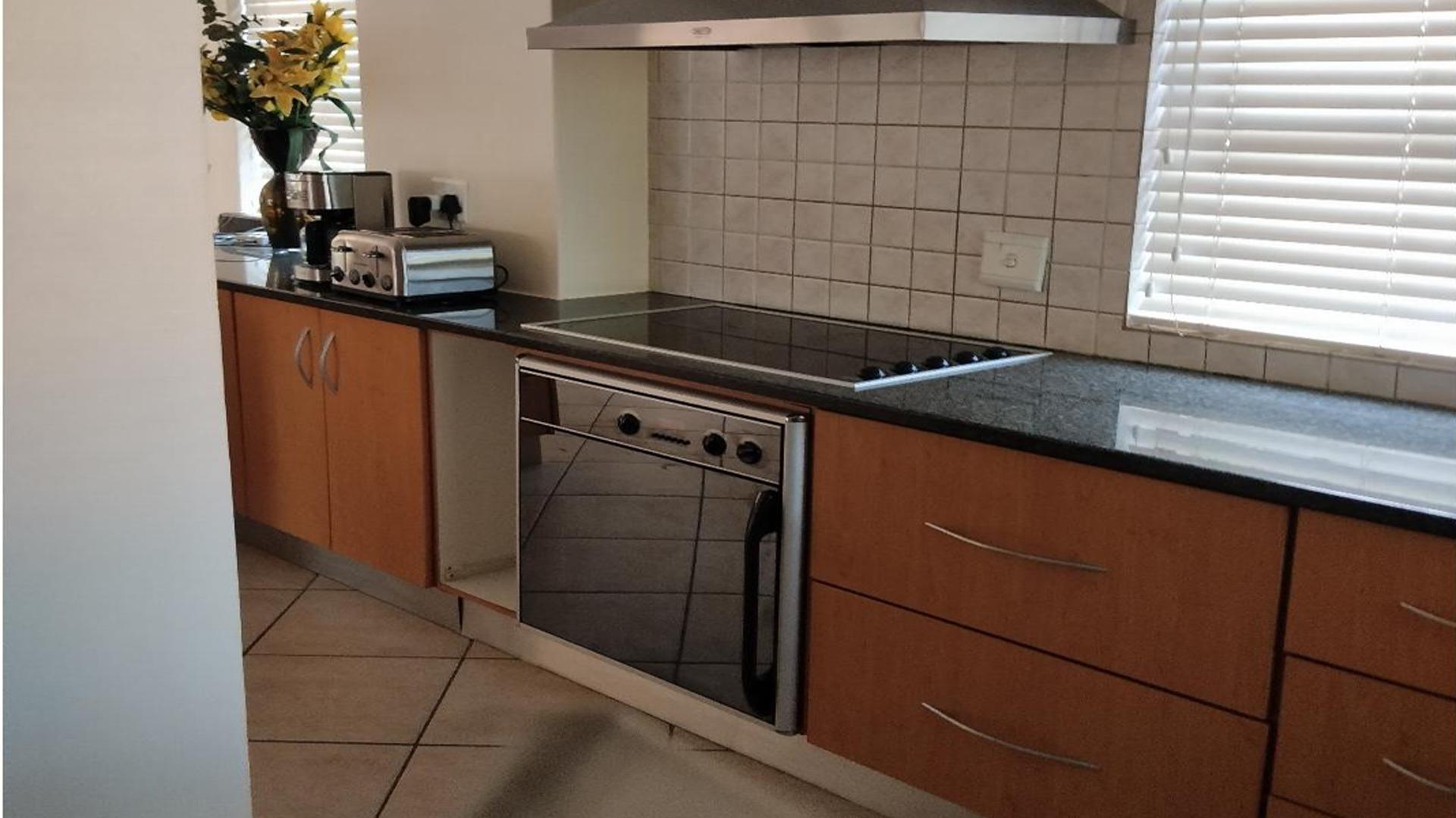 Kitchen of property in Rooihuiskraal North