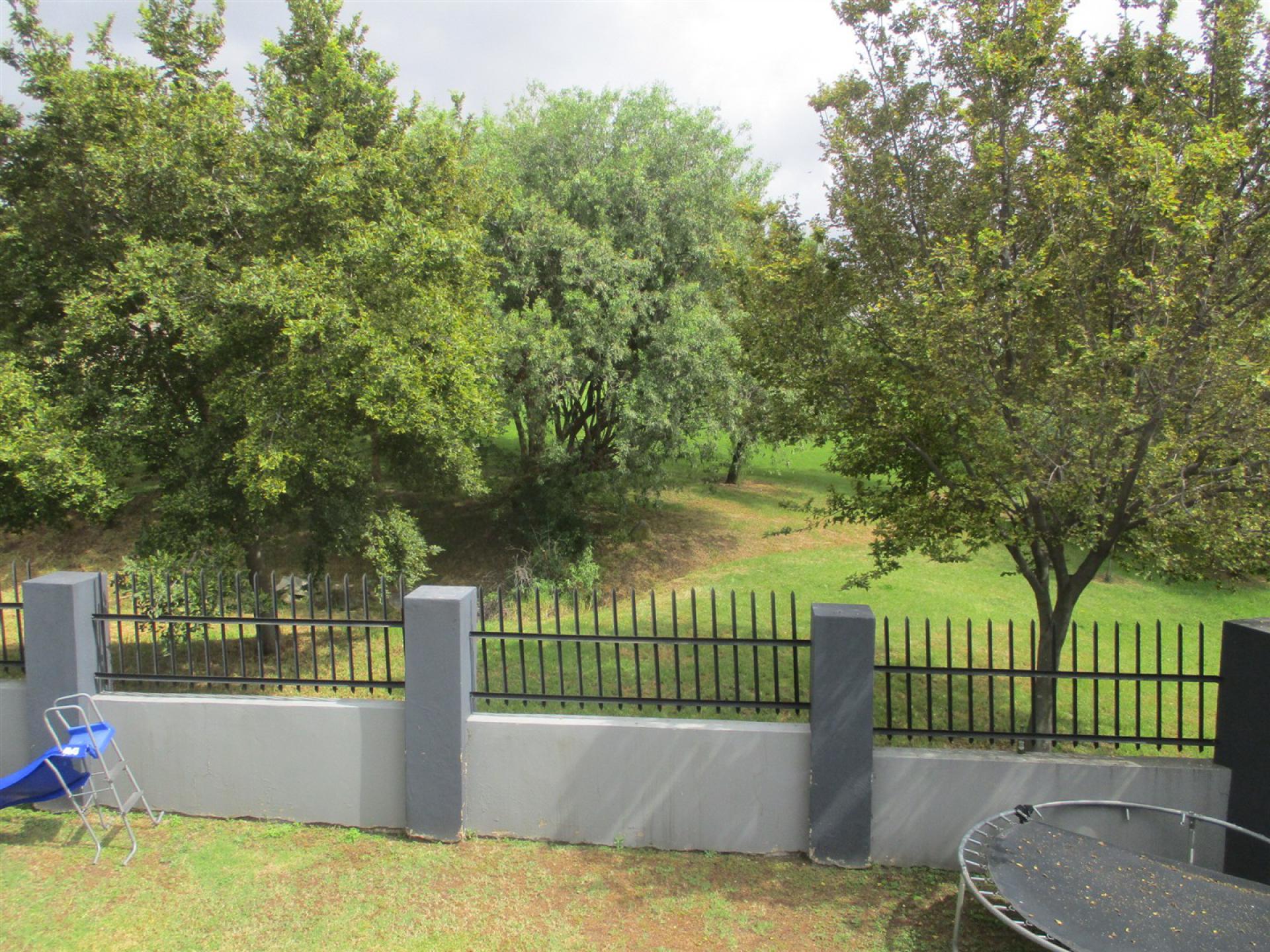 Backyard of property in Blue Valley Golf Estate