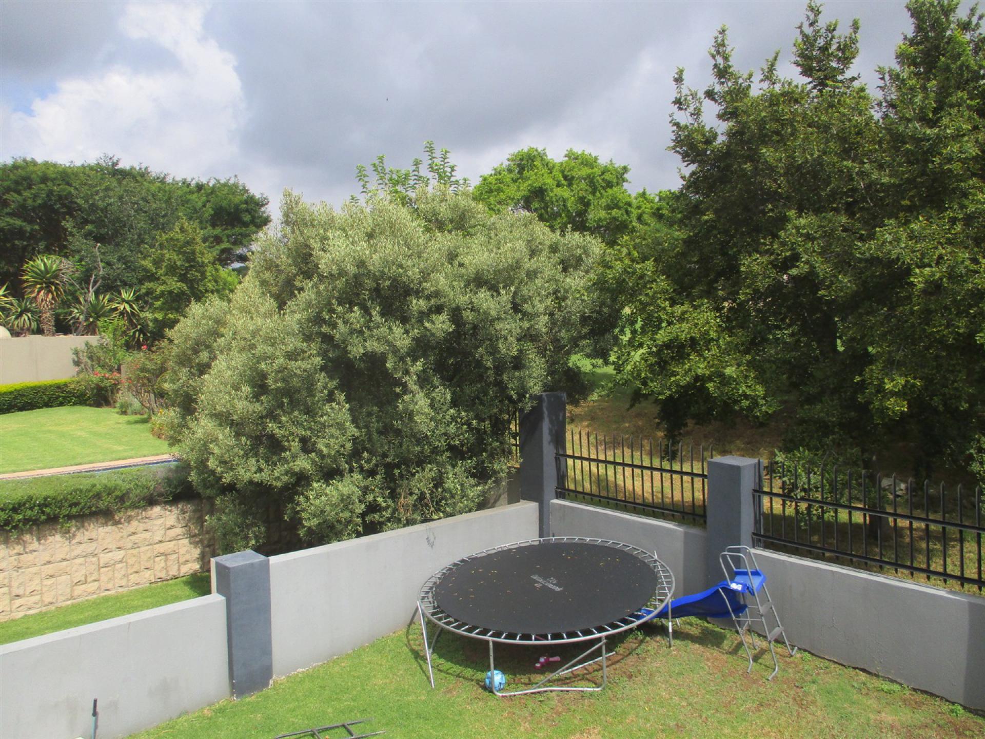 Backyard of property in Blue Valley Golf Estate