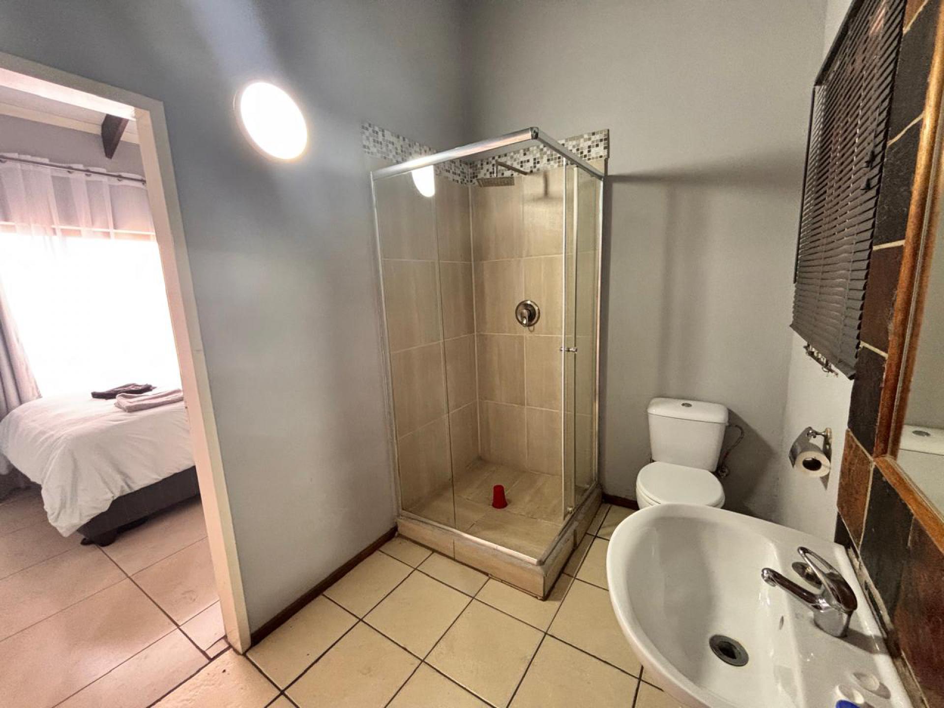 Main Bathroom of property in Roodepoort