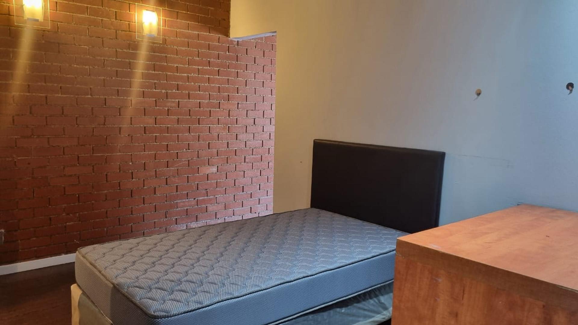 Bed Room 1 of property in Braamfontein