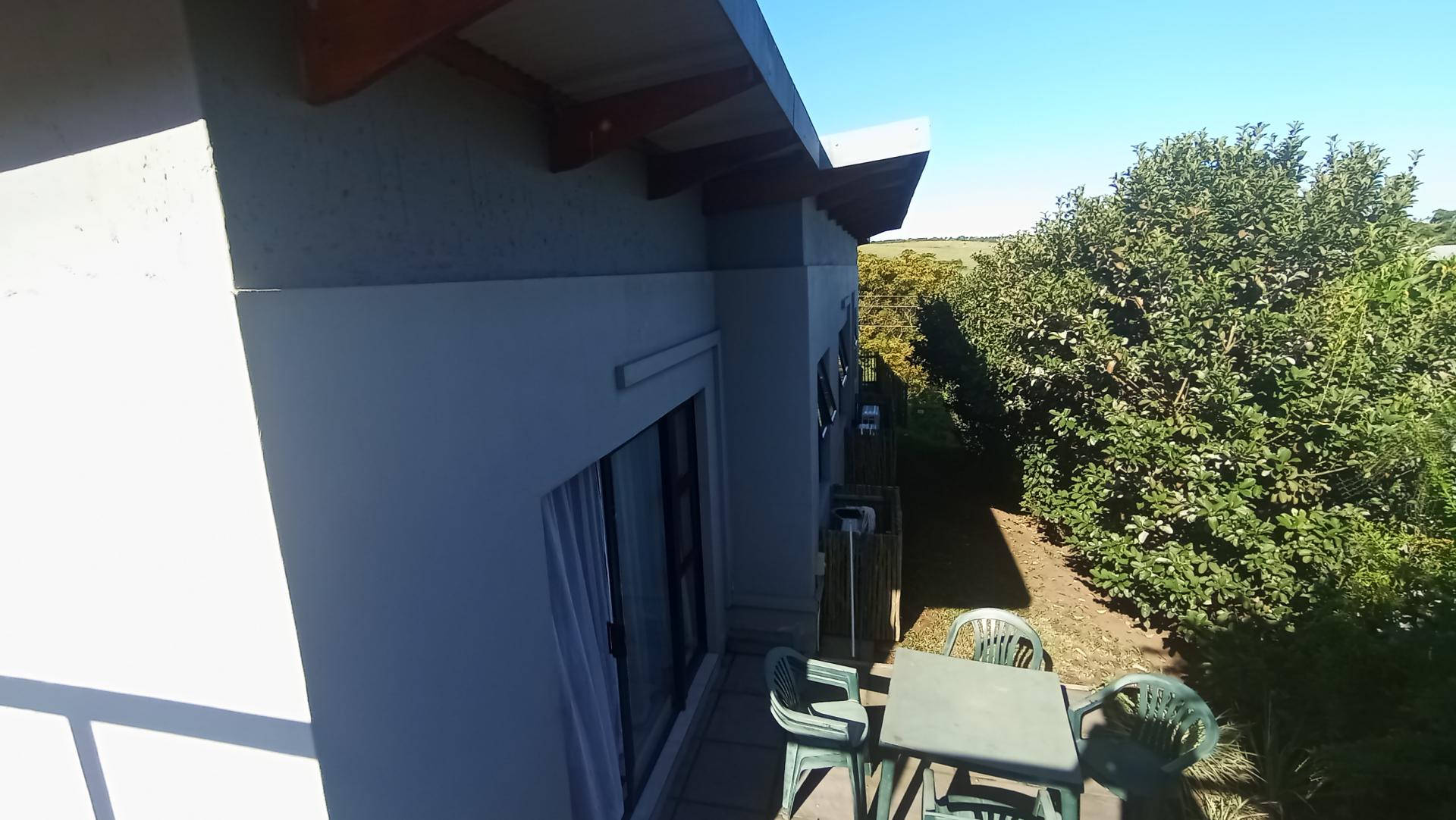 Backyard of property in Palm Lakes Family Estate