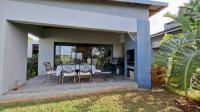 Backyard of property in Palm Lakes Family Estate