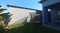 Backyard of property in Palm Lakes Family Estate