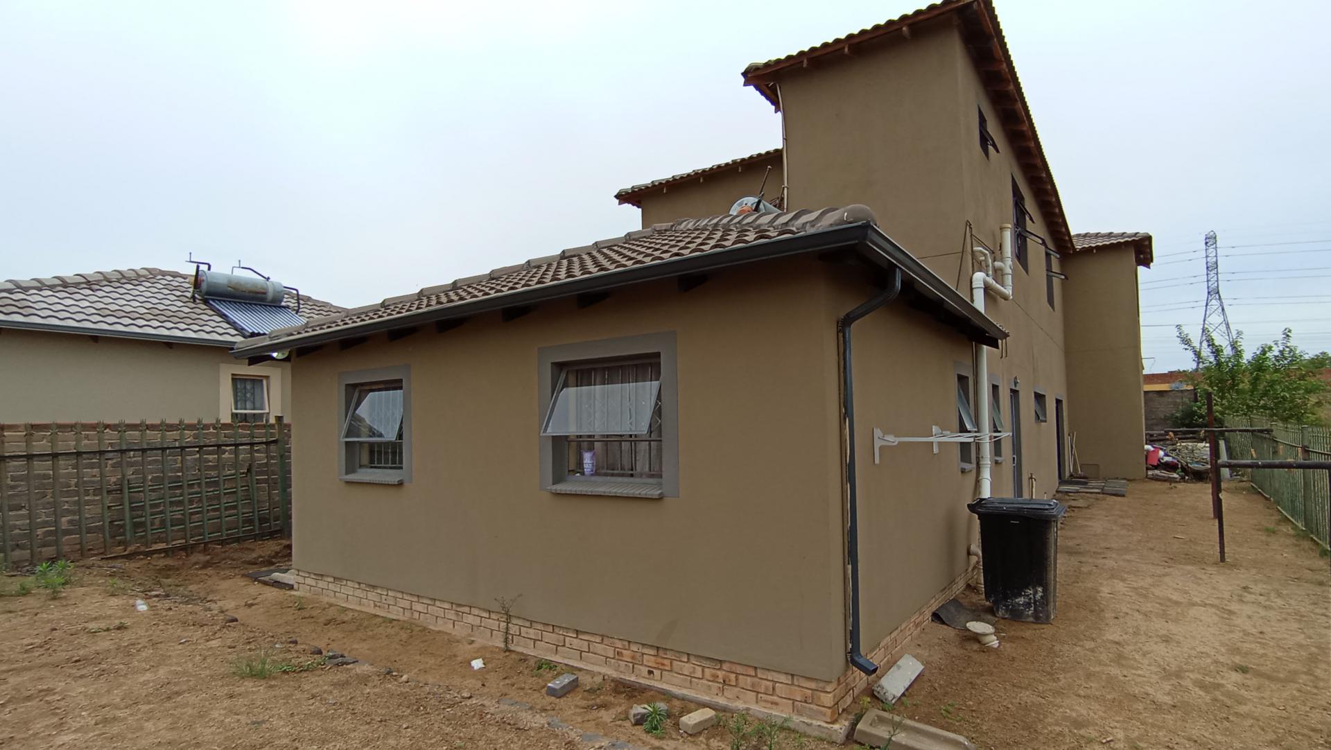 Backyard of property in Riverside View