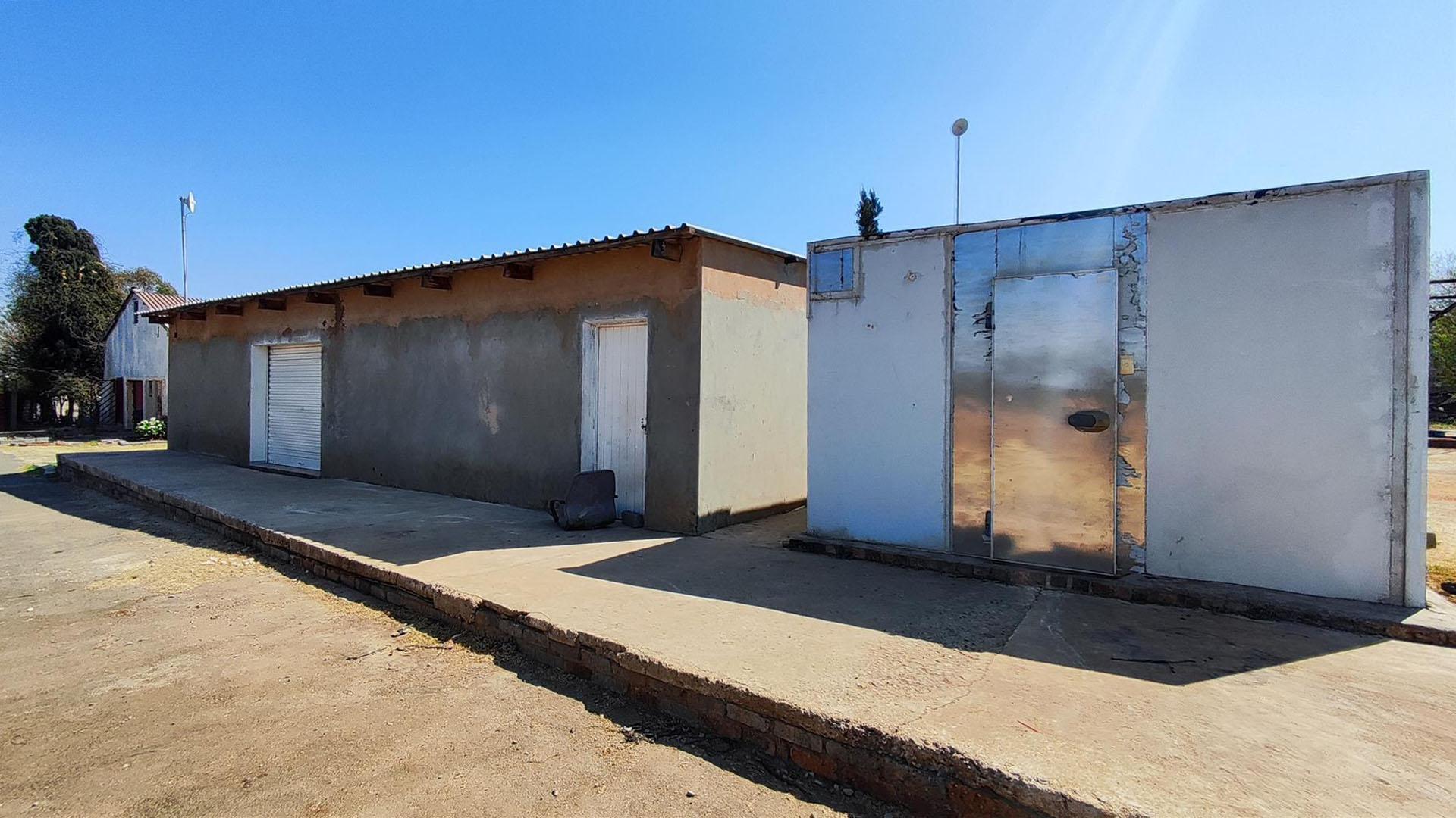 Backyard of property in Homestead Apple Orchards AH