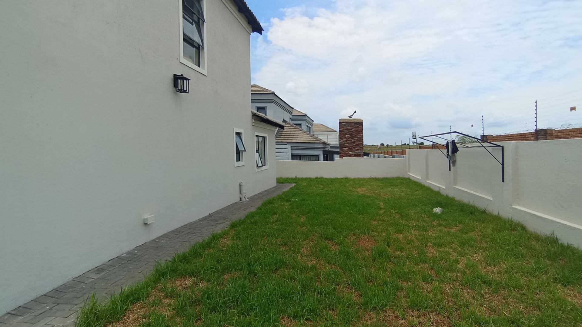 Backyard of property in Blue Valley Golf Estate