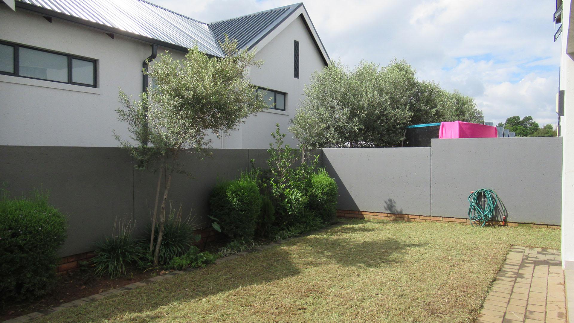 Backyard of property in Homes Haven