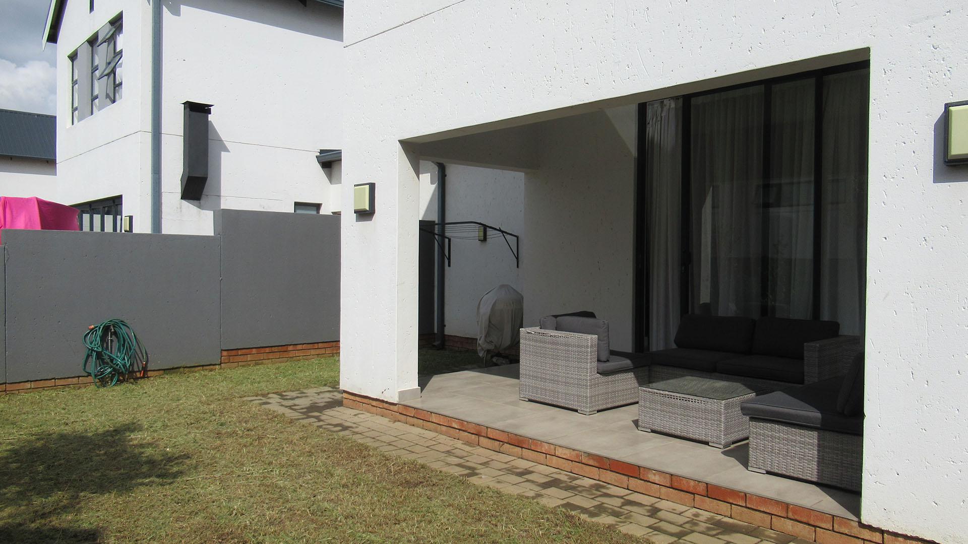 Backyard of property in Homes Haven