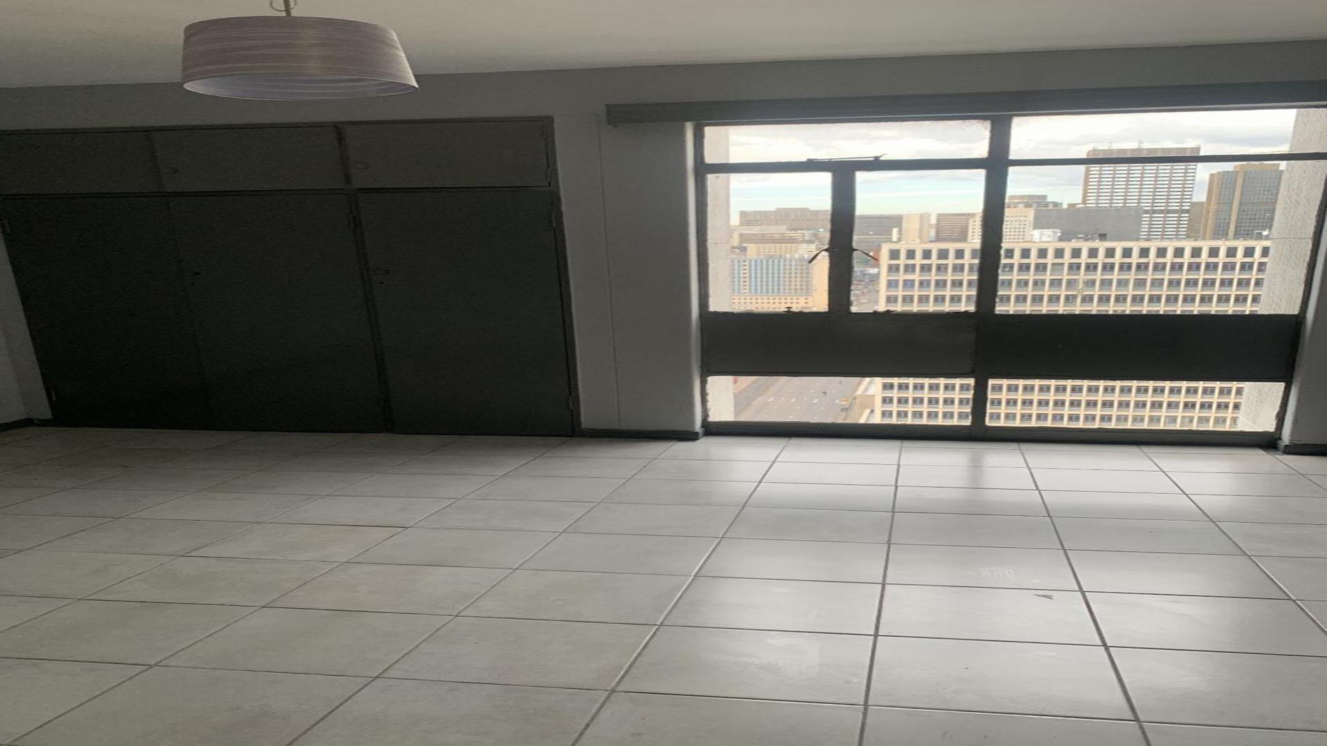 Bed Room 1 of property in Johannesburg Central