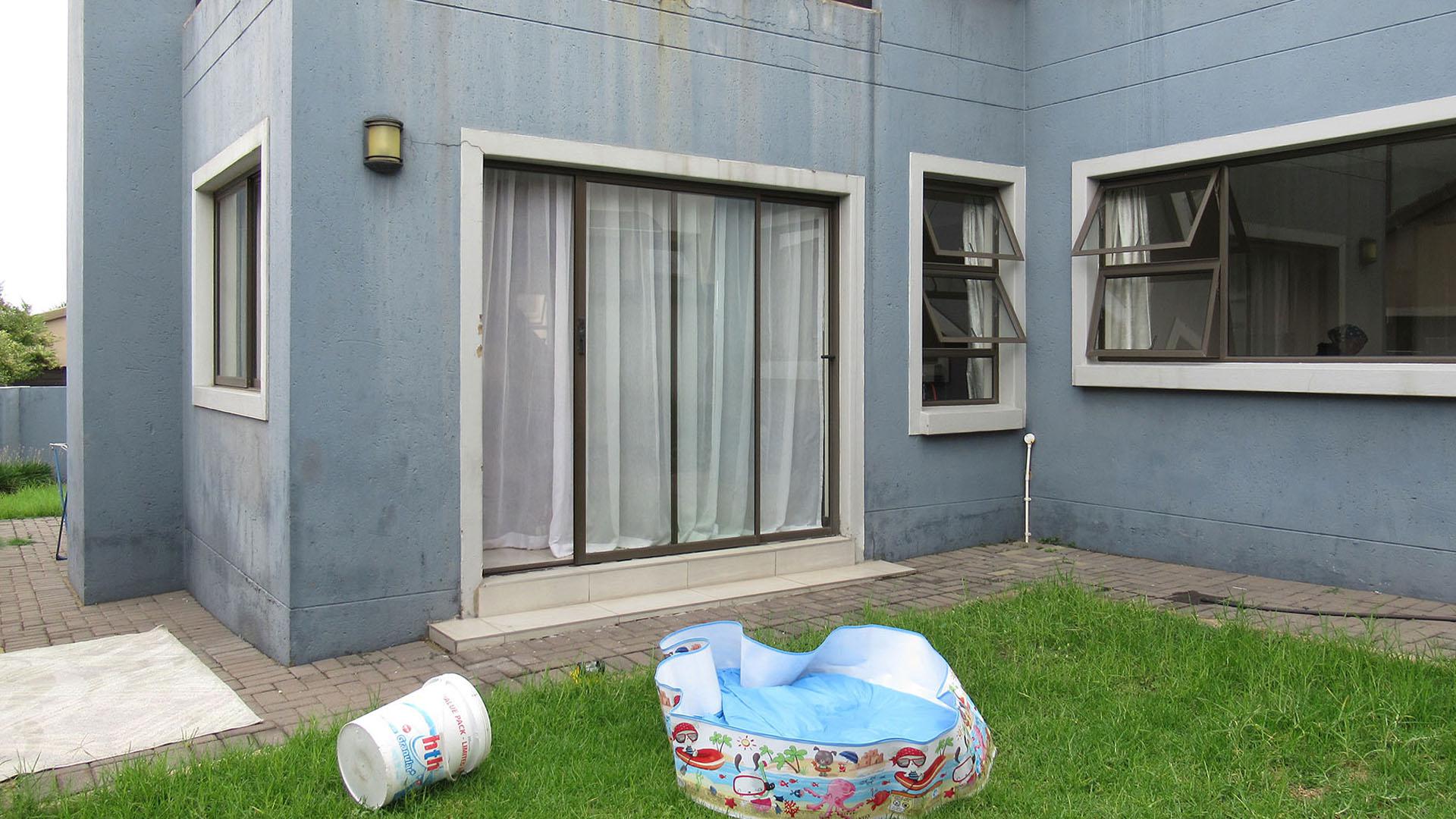 Backyard of property in Homes Haven