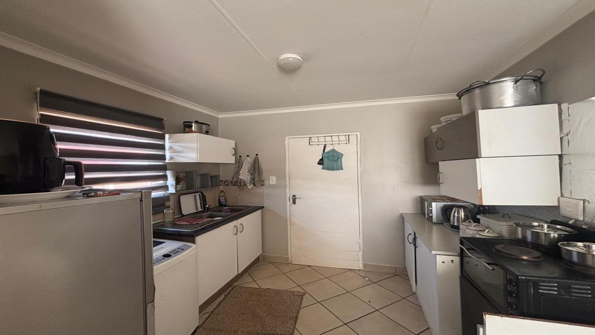 Kitchen of property in Azaadville Gardens