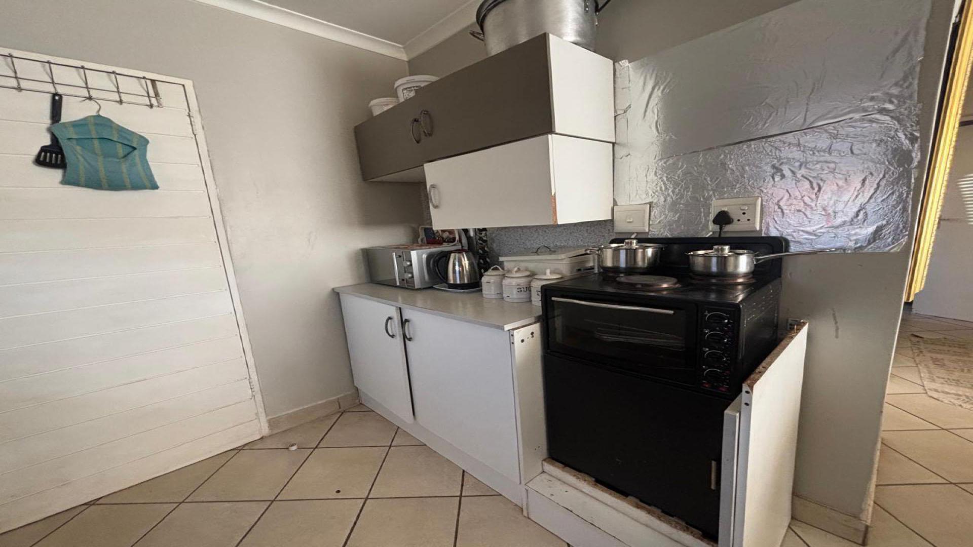 Kitchen of property in Azaadville Gardens