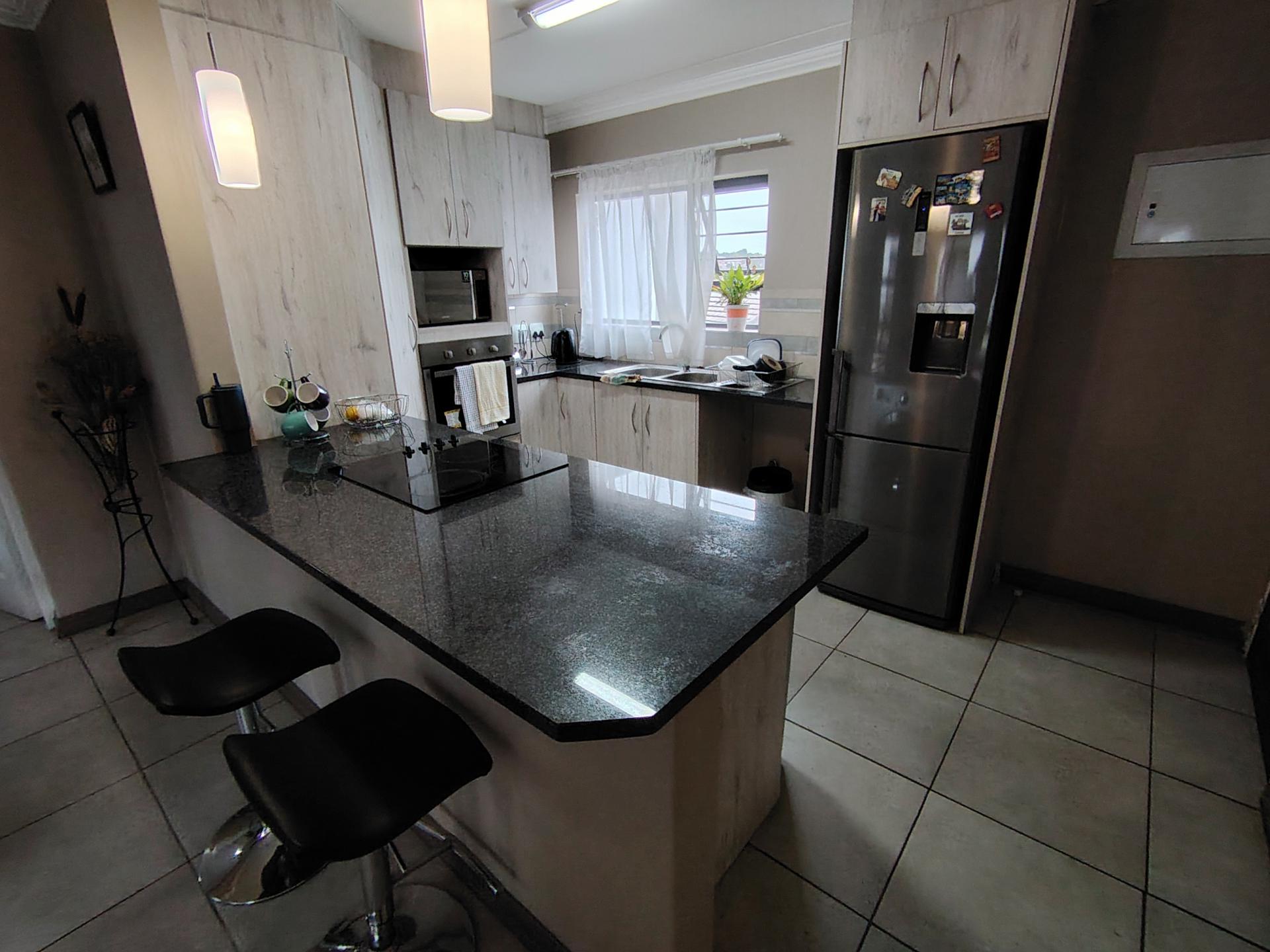 Kitchen of property in Rooihuiskraal North