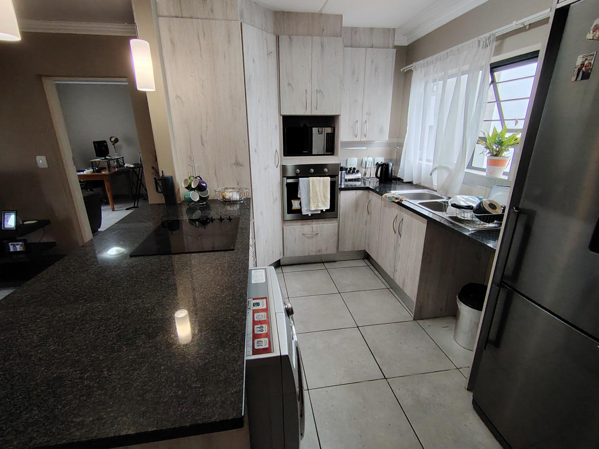 Kitchen of property in Rooihuiskraal North