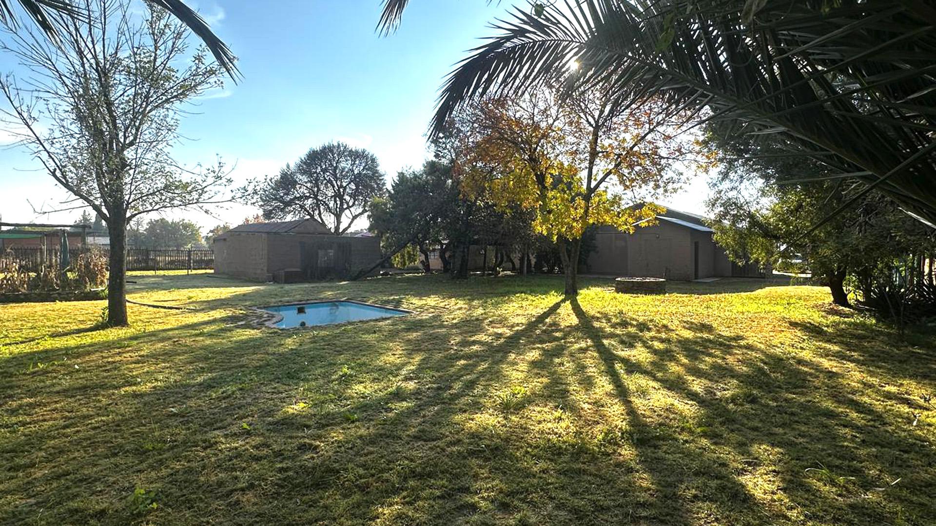 Backyard of property in DEALESVILLE