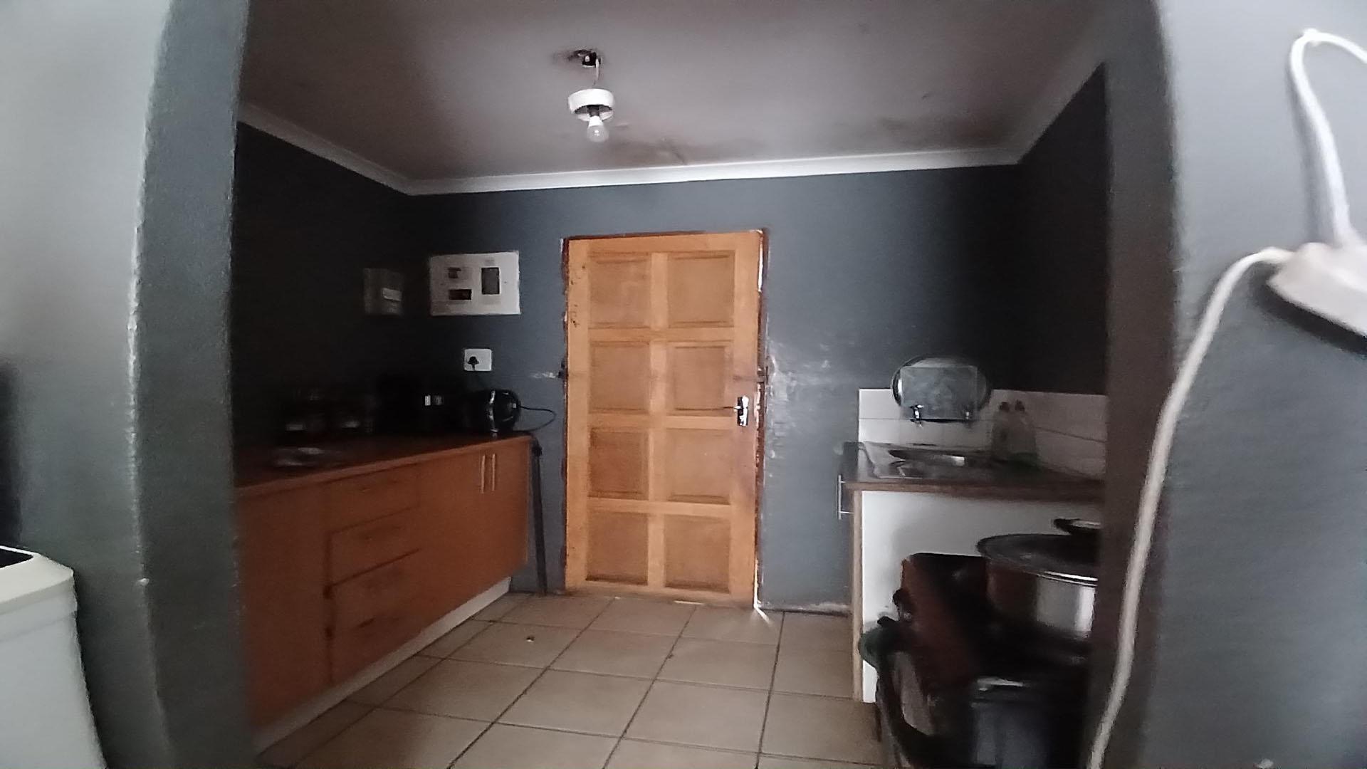 Kitchen of property in Azaadville Gardens