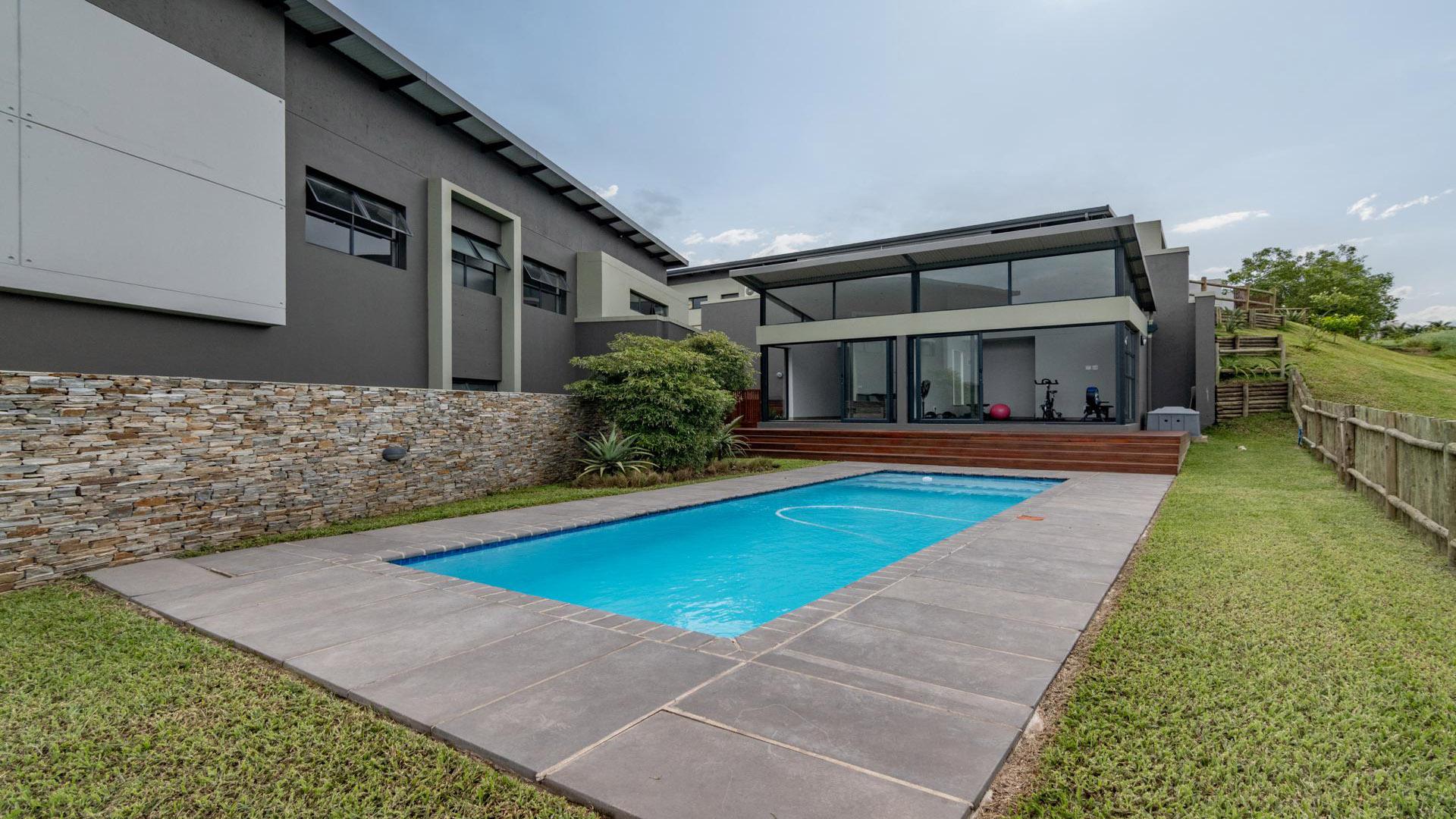 Backyard of property in Palm Lakes Family Estate