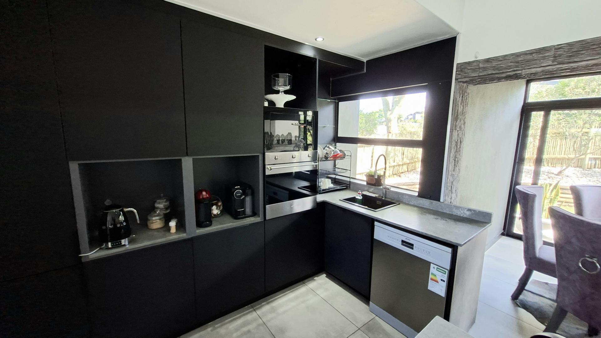 Kitchen of property in Palm Lakes Family Estate
