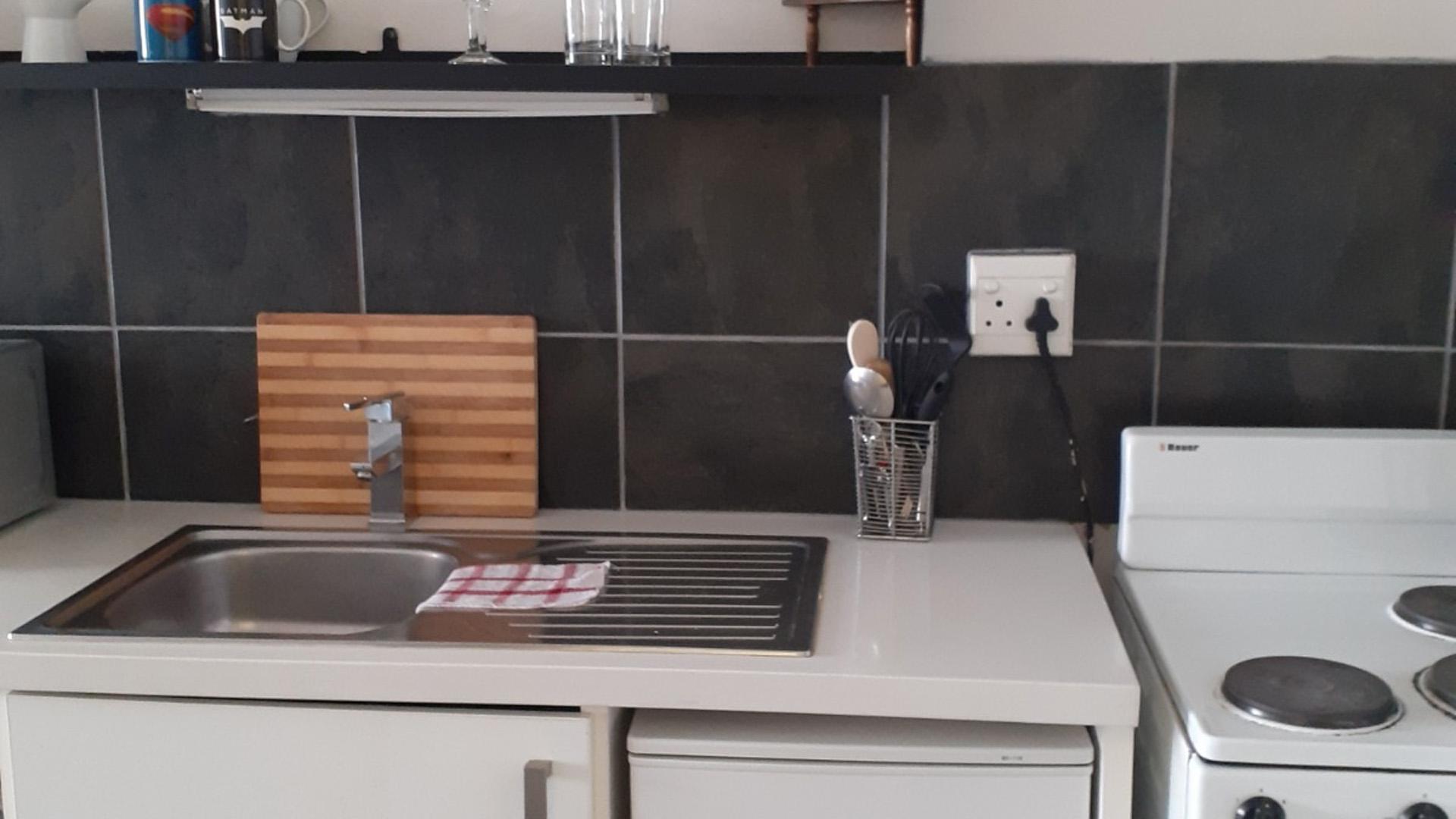 Kitchen of property in City and Suburban