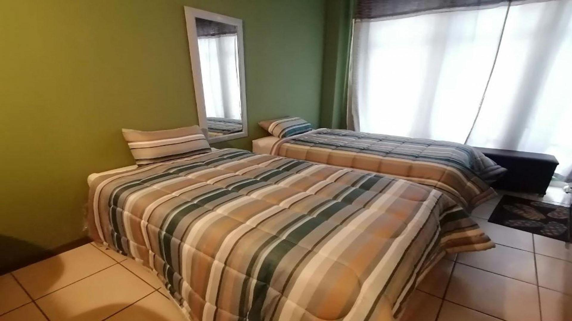 Bed Room 1 of property in Johannesburg Central